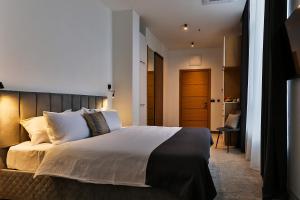 Postel nebo postele na pokoji v ubytování Hotel Boka