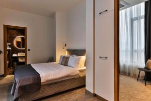 Postel nebo postele na pokoji v ubytování Hotel Boka