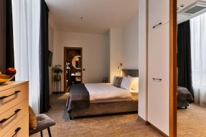 Postel nebo postele na pokoji v ubytování Hotel Boka