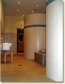 a hallway of a building with a sink and a pillar at Hotel Ritschlay in Bollendorf