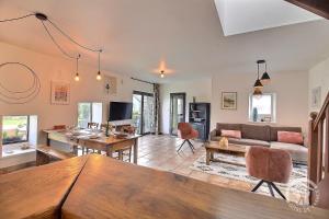 a living room with a couch and a table at Domaine de la motte in Plourhan