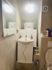 a bathroom with a sink and a toilet at Casa Behar in Kotor +17 photos