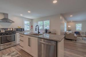 a kitchen with a sink and a counter top at The Luxe in Marion