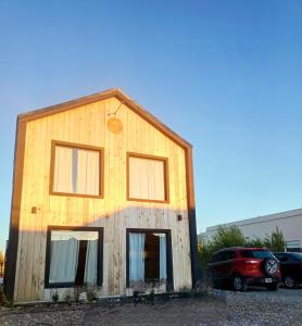 a house with a car parked in front of it at Laguna Studios in El Calafate