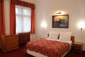 Letto o letti in una camera di Unitas Residence