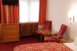 Letto o letti in una camera di Unitas Residence