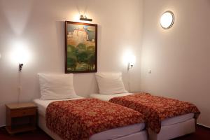 Letto o letti in una camera di Unitas Residence