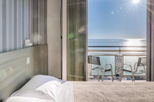 Postel nebo postele na pokoji v ubytování Hotel Centrale Miramare