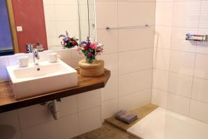 a bathroom with a sink and a shower at EcoHotel L’Aubier in Montézillon +25 photos