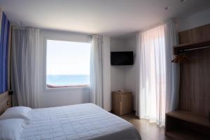 Posteľ alebo postele v izbe v ubytovaní Hotel La Martinica + 37 fotografií