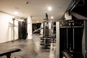 a fitness room with a gym with tread machines at Radisson San Luis Potosi Aeropuerto in Santa Ana