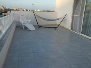 شرفة أو تراس في Penthouse next to the beach