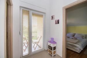 Postel nebo postele na pokoji v ubytování Apartment Ninić