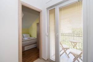 Postel nebo postele na pokoji v ubytování Apartment Ninić