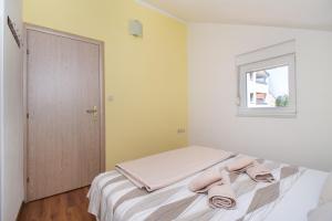 Postel nebo postele na pokoji v ubytování Apartment Ninić