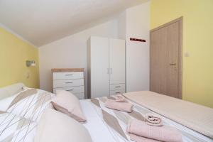 Postel nebo postele na pokoji v ubytování Apartment Ninić