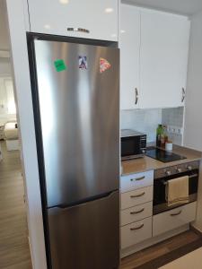 Kuchyň nebo kuchyňský kout v ubytování Moderno apartamento centrico con increíbles vistas al mar