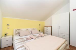 Postel nebo postele na pokoji v ubytování Apartment Ninić