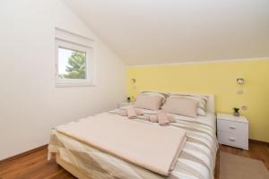 Postel nebo postele na pokoji v ubytování Apartment Ninić