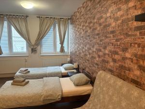 Posteľ alebo postele v izbe v ubytovaní Žižkov Cosy Studio Apartments