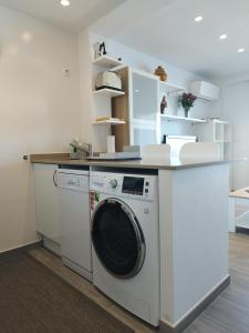 Kuchyň nebo kuchyňský kout v ubytování Moderno apartamento centrico con increíbles vistas al mar + 4 fotografie