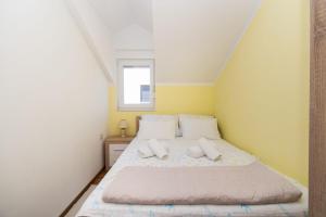 Postel nebo postele na pokoji v ubytování Apartment Ninić