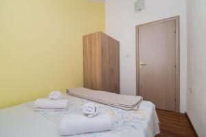 Postel nebo postele na pokoji v ubytování Apartment Ninić