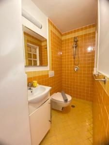 a bathroom with a toilet and a sink at Positano's Flats in Positano