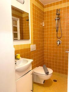 a bathroom with a toilet and a sink at Positano's Flats in Positano