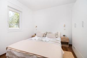 Postel nebo postele na pokoji v ubytování Apartment Ninić