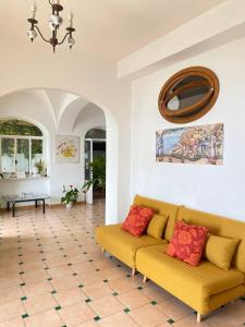 a living room with a couch and a table at Positano's Flats in Positano