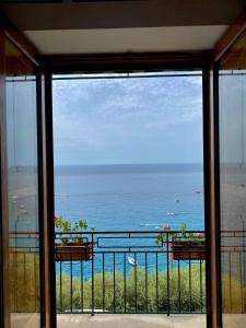 a view of the ocean from a balcony at Positano's Flats in Positano