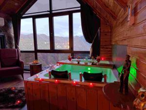 a pool table in a room with a view at Seyri Alem suit villa Bungalow in Ardeşen