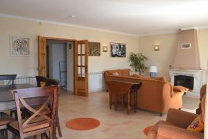 a living room with a couch and a table at Liv In by Ericeira Property in Santo Isidoro