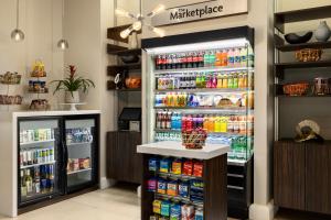 a large refrigerator filled with lots of drinks at Crowne Plaza Orlando-Downtown by IHG in Orlando