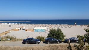 three cars parked in a parking lot at the beach at NeverseaBlack Sea in Constanţa