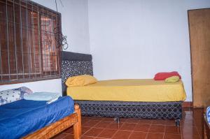 Una cama o camas en una habitación de Hospedaje Don Evaristo