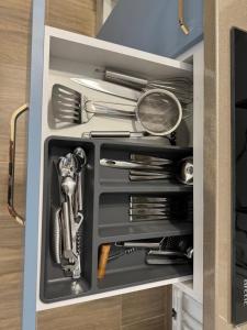 a drawer filled with utensils in a kitchen at Michael2 in Galaţi