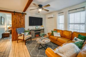 a living room with a couch and a flat screen tv at RockinB88 Ranch Retreat Terrell Home Near Shops in Terrell