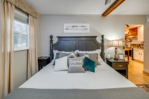 a bedroom with a large bed with pillows on it at RockinB88 Ranch Retreat Terrell Home Near Shops in Terrell