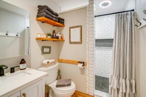 a bathroom with a toilet and a shower at RockinB88 Ranch Retreat Terrell Home Near Shops in Terrell +17 photos