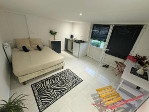 a bedroom with a bed and a table and a chair at Bundel Grande Villa 6 chambres in Saint-Géréon