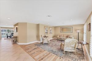 a living room with a couch and a table at 803 Napoli in Punta Gorda