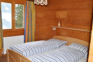 Letto o letti in una camera di Chalet Edelweiss