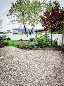 a backyard with a garden with flowers and plants at Bright & Cozy Basement Retreat in American Fork