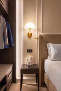 Postel nebo postele na pokoji v ubytování BH Hotel
