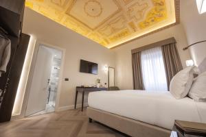 Postel nebo postele na pokoji v ubytování BH Hotel