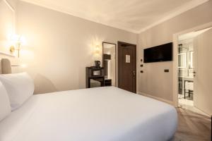 Postel nebo postele na pokoji v ubytování BH Hotel