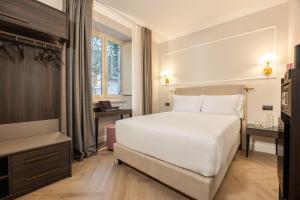 Postel nebo postele na pokoji v ubytování BH Hotel