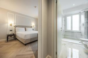 Postel nebo postele na pokoji v ubytování BH Hotel